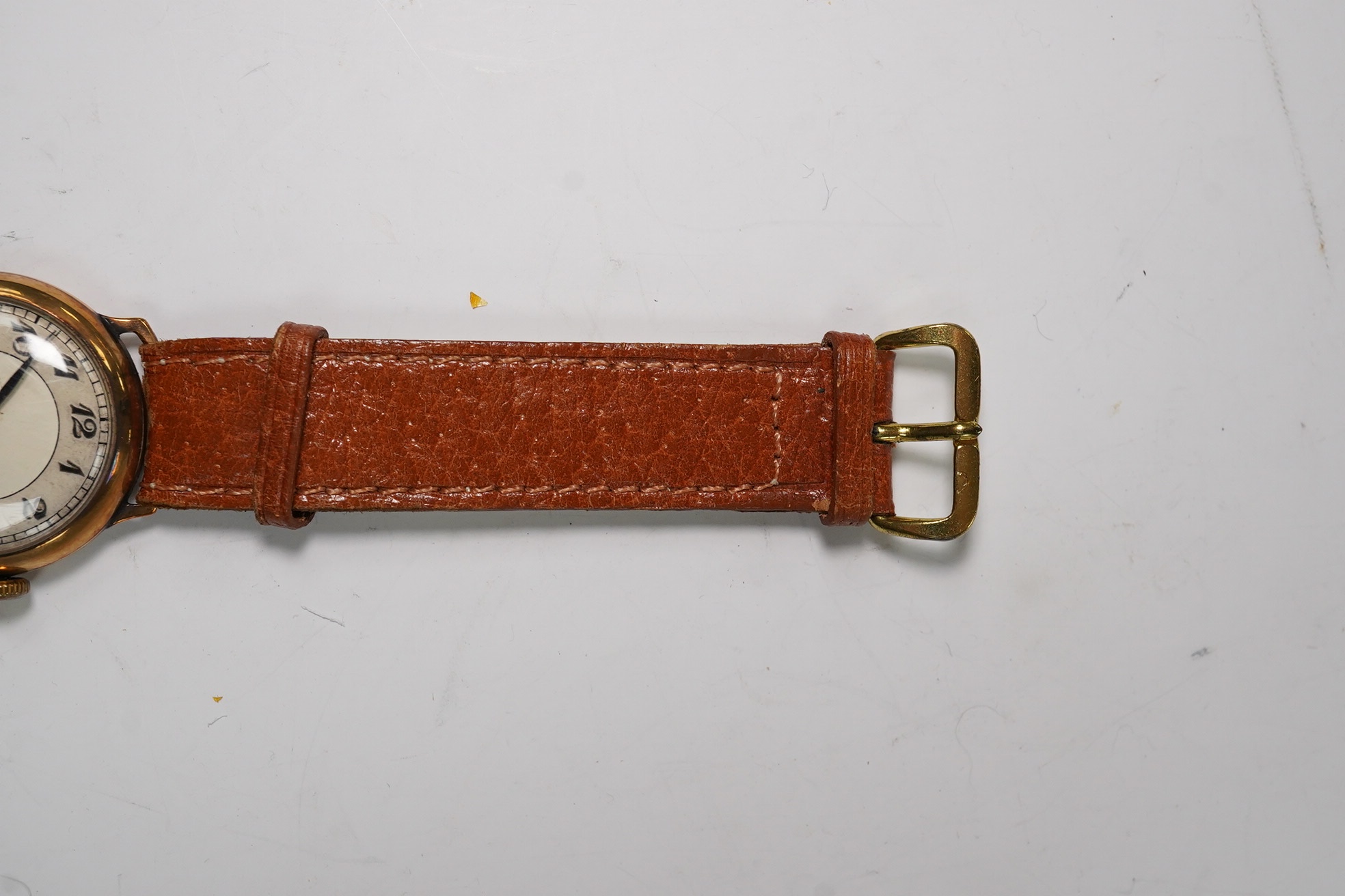 A gentleman's 1930's 9ct gold manual wind wrist watch, with Arabic dial and subsidiary seconds, case diameter 29mm, on a later leather strap. Condition - poor